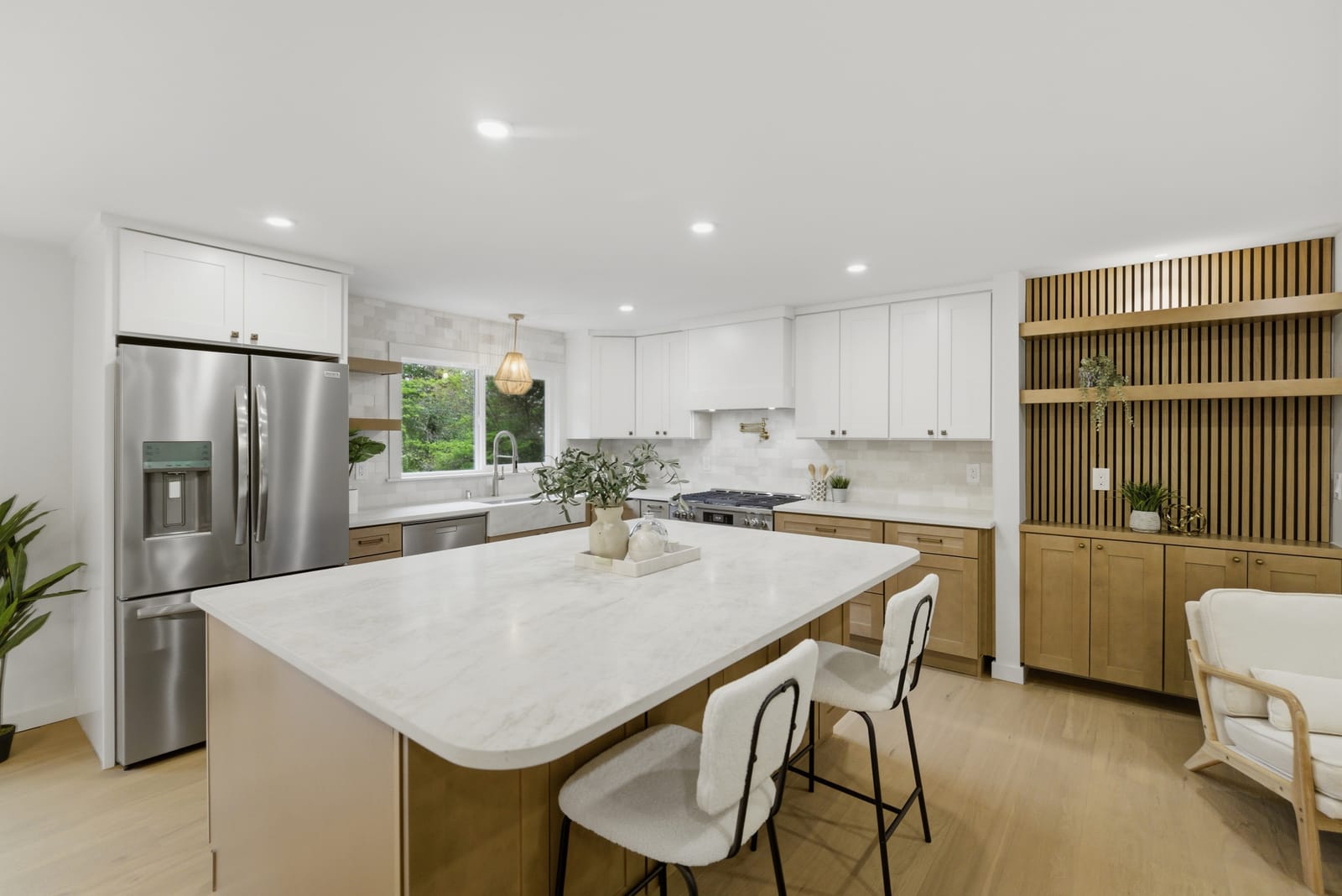 White kitchen with wood island, Lake Forest Park