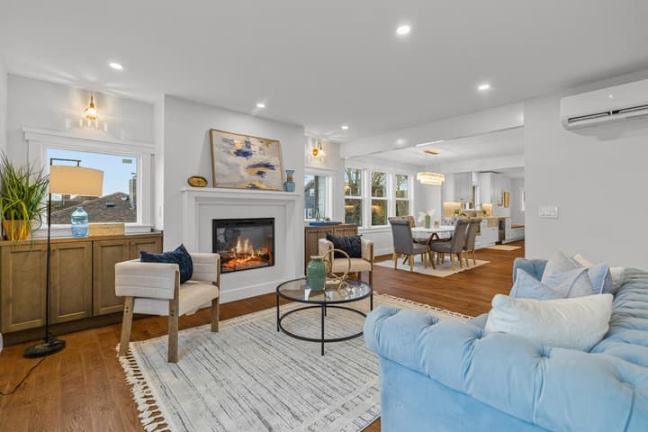 Living room with fireplace and open dining