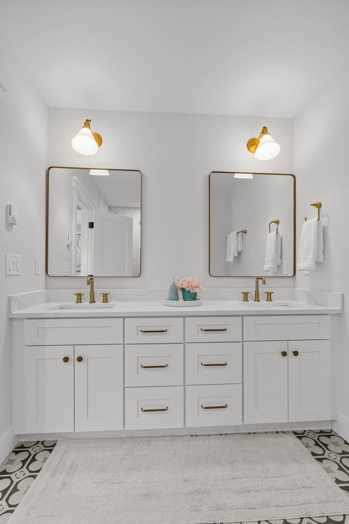 Double vanity with brass fixtures