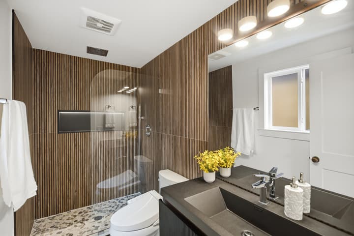 Bathroom with wood-look tile and brass