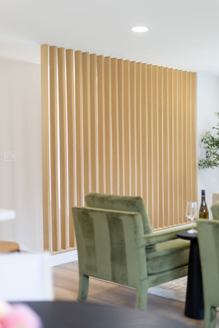 Slat-wall feature with green accent chair