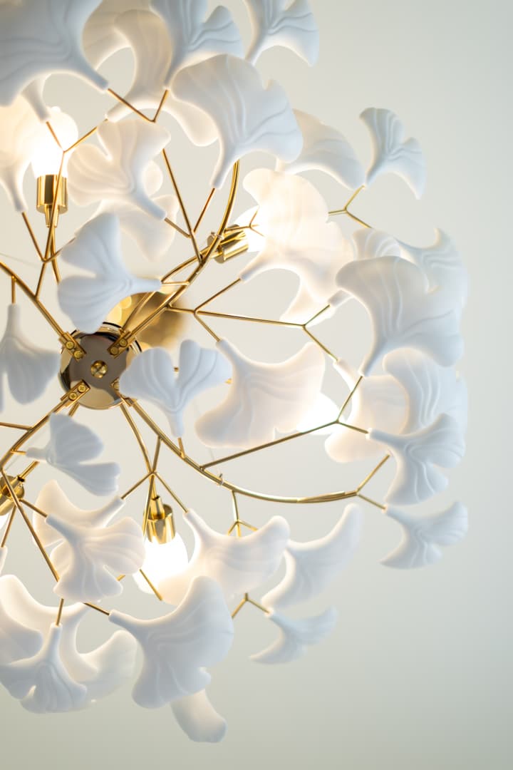 Brass leaf chandelier over the dining table