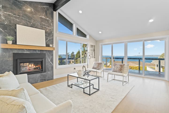 Living room with marble-look fireplace surround