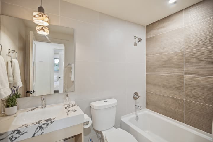 Bathroom with large-format tile tub surround